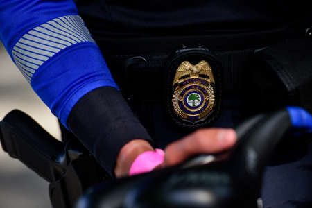 Miami Downtown, FL, USA - MAY 31, 2020: Detective. Miami Police. Police badge. Protect and serve, crime fighting concept with a police badge. Detective concept.のeditorial素材