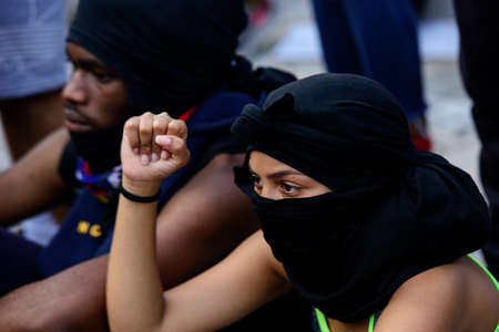 Miami Downtown, FL, USA - MAY 31, 2020: Female fighter. Human rights. Fist up.のeditorial素材