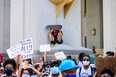 Miami Downtown, FL, USA - MAY 31, 2020: Young people against racism in the USA.