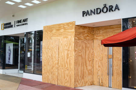Miami Beach, FL, USA - JUNE 7, 2020: Pandora brand in plywood box. Symbolic protection of stores in the United States from robbers and lootersのeditorial素材