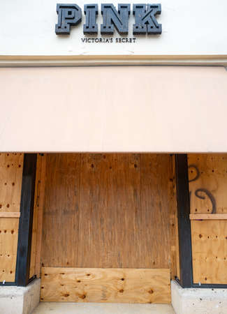 Miami Beach, FL, USA - JUNE 7, 2020: Pink store protect storefronts from burglars during nationwide protests in USA.のeditorial素材