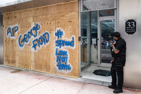 Miami Downtown, FL, USA - JUNE 4, 2020: RIO George Floyd. Security guard Protects Business From destruction and Looting During US Protests. U.S. cities assess protest damage. Protesters and looters.のeditorial素材