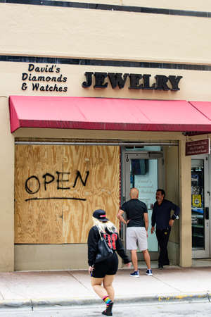 Miami Downtown, FL, USA - JUNE 4, 2020: US stores closed with plywood from robbery.のeditorial素材