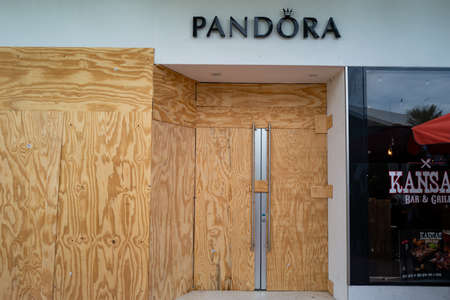 Pandora store is hidden behind plywood. Robberies in the USA.のeditorial素材