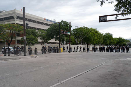 Miami Downtown, FL, USA - JUNE 12, 2020: Miami police concept. Police blocked the road during protests Black Lives Matter. Many american people went to peaceful protests in the US.のeditorial素材