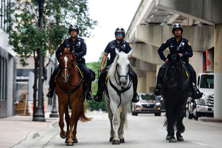Miami Downtown, FL, USA - JUNE 4, 2020: Police officers on horseback. Mounted Police.のeditorial素材