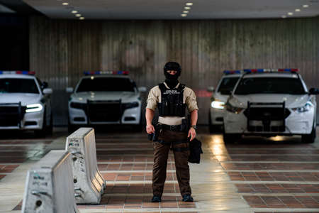 Miami Downtown, FL, USA - JUNE 12, 2020: Police officer and police carsのeditorial素材