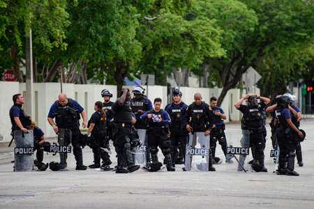Miami Downtown, FL, USA - JUNE 12, 2020: Black Lives Matter. U.S police officers with shieldsのeditorial素材