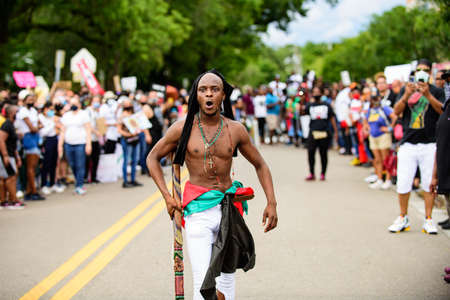 Orlando, FL, USA - JUNE 19, 2020: Emotional black man screams during a protest in the USA.のeditorial素材
