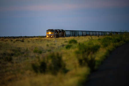 Train in the prairie of the USA. Train and delivery of goods. Transport business.