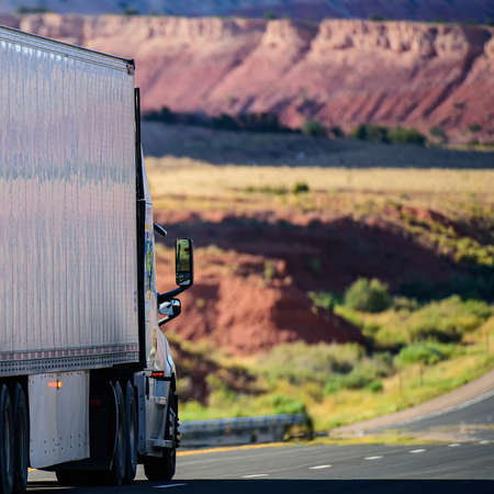 Truck on the background of the Grand Canyon. Freight transport in the USA. Arizona delivery. Way...
