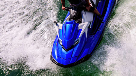 Speed on the ocean. Jetski. Beautiful sport on ocean waves. Tourist on a jet ski. Rest on the ocean. Summer vacation.の写真素材