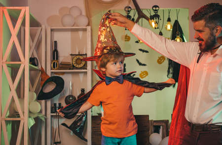 Father and son are preparing for Halloween. Halloween costumes.の写真素材