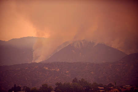 Fires and air pollution. Smoke and fire in the mountains of California. Climate change.