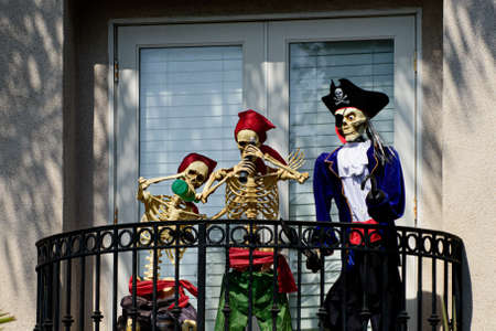 Skeletons pirates on the balcony at home. Halloween scenery. Terrible holiday at home. Halloween in the USA. Traditions and house decor. Terrible creatures.の写真素材