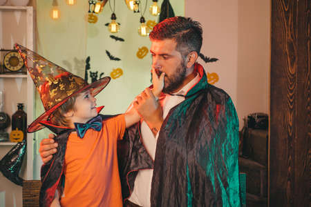 Scary night. Secret. Father and son in costumes for Halloween party.の写真素材