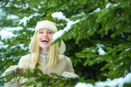 Happy girl in winter forest.の写真素材