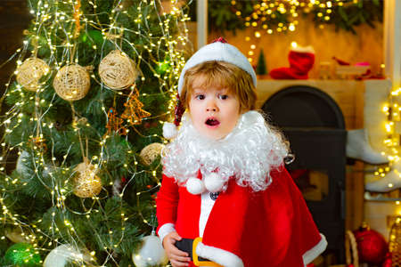 Child Santa Clause, Christmas surprise.の写真素材