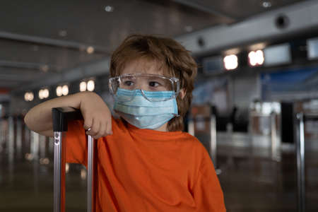 Travel. Coronavirus protection. Child face in a mask.の写真素材