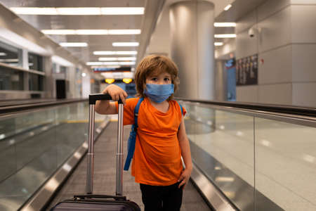 Travel. Coronavirus protection. Child face in a mask.の写真素材