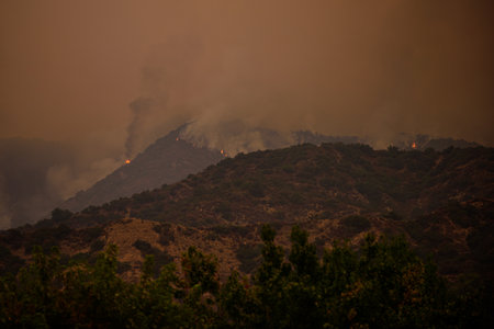 Fire and smoke in the mountains of California. Forest fires. Air Pollution. Toxic smoke. Fires in the United States. Climate change.の写真素材