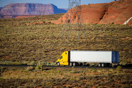 Arizona, USA - 2020: American trucks in mountains. Roads in the United States, delivery of goods. Transport business.の写真素材