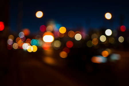 Bokeh background. Big city lights, travel and roads. Vintage defocused night colors. Abstract blur evening.の写真素材