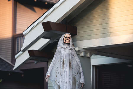 Skeleton of death in a white coat. Scenery for Halloween in October. Decoration in the yard.の写真素材