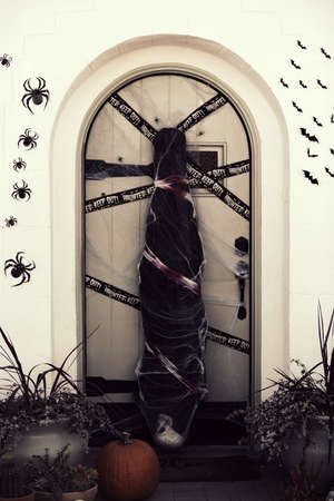 Corpse at the door of the family home. Scenery for Halloween in October. Decoration in the yard.の写真素材