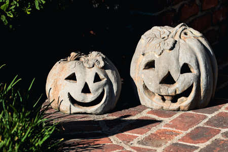 Stone pumpkin carving. Scenery for Halloween in October. Decoration in the yard.の写真素材