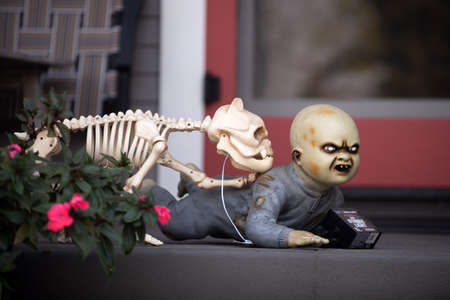 Dog skeleton and baby monster. Scenery for Halloween in October. Decoration in the yard.の写真素材