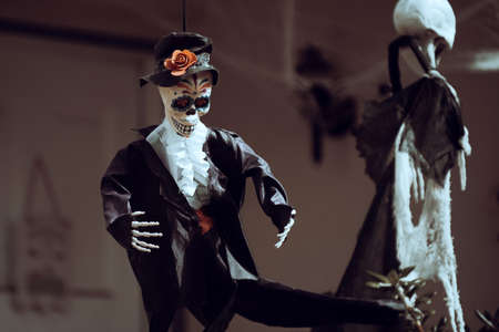 Mexican skeleton in a business suit. Dead businessman. Scenery for Halloween in October. Decoration in the yard.の写真素材