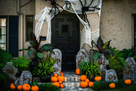 Pumpkins and tombstones. Scenery for Halloween in October. Decoration in the yard.の写真素材