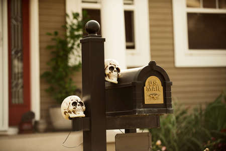 Skulls on the mailbox. Scenery for Halloween in October. Decoration in the yard.の写真素材
