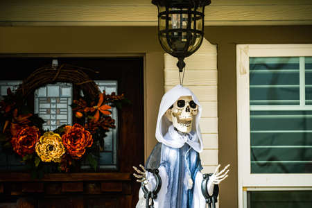 Death hostess near the house. Scenery for Halloween in October. Decoration in the yard.の写真素材