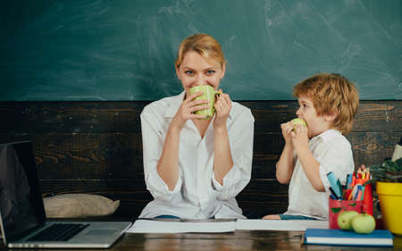 Snack in home school break. The teacher and the boy eat together. Lunch. Homeschoolingの写真素材