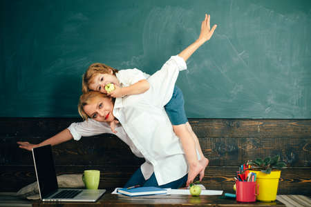 Educational games. Teacher is skilled leader. Woman and student boy kid.の写真素材