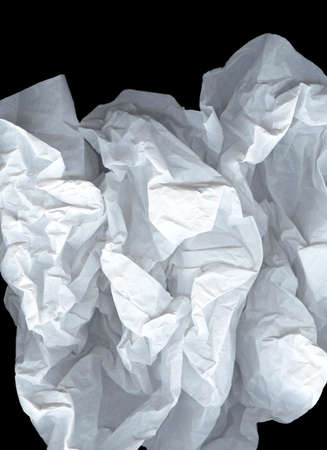 Large light elegant cloud of crumpled paper on a black background. White and gray wide crumpled paper texture background. Crushed paper, creased and wrinkled. The concept of lightness, transparency.の写真素材