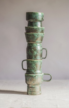 vertical pyramid designer cups, green-metal colorの写真素材