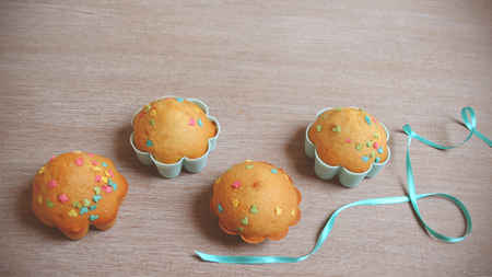 Beautiful cute Easter cupcakes on wood background while cookingの写真素材