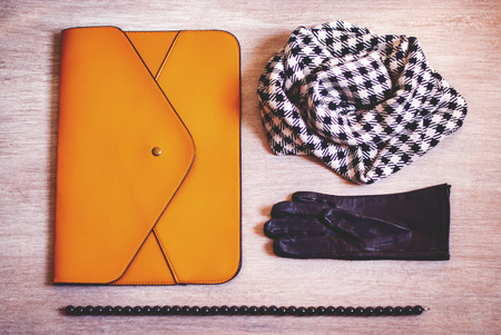 Color of mustard, black and white female clothing set. clutch, gloves, beads and scarf - fashion layout.の写真素材