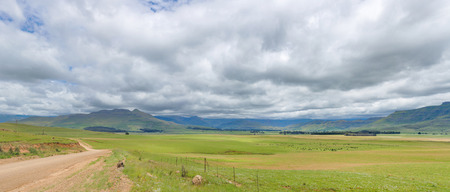 Gravel road to the mountainの写真素材