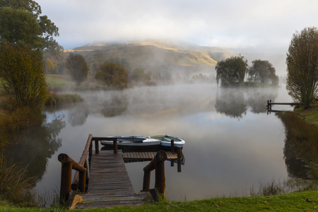 Mist on the water in the morningの写真素材