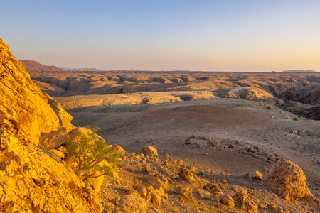 Yellow light at sunset on the side of the Kuiseb Canyon Namib Desert Namibiaの写真素材