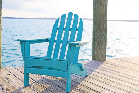 Blue Deck Chair on Wooden Dockの写真素材