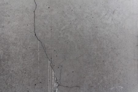 background: aged stone background - gray concrete with cracksの写真素材