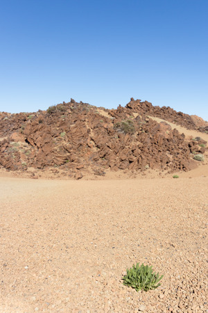 volcano landscape / desert - sand, rocks, blue skyの写真素材