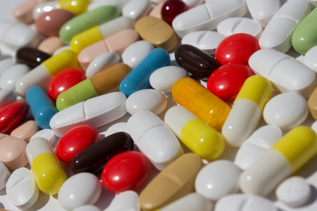 Many colored pills / capsules / tablets - medical backgroundの写真素材