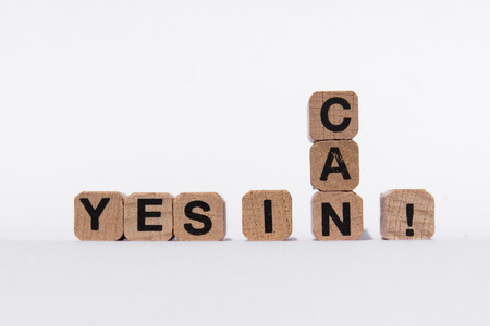 Yes I Can - motivation text on wooden cubes, isolated on white backgroundの写真素材