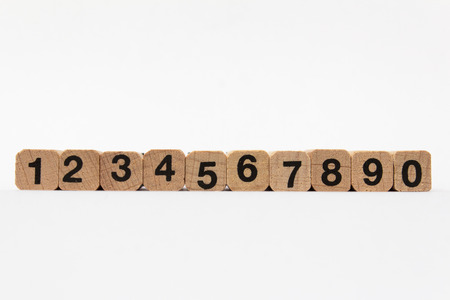 Numbers one to ten on wood cubes isolated on white backgroundの写真素材